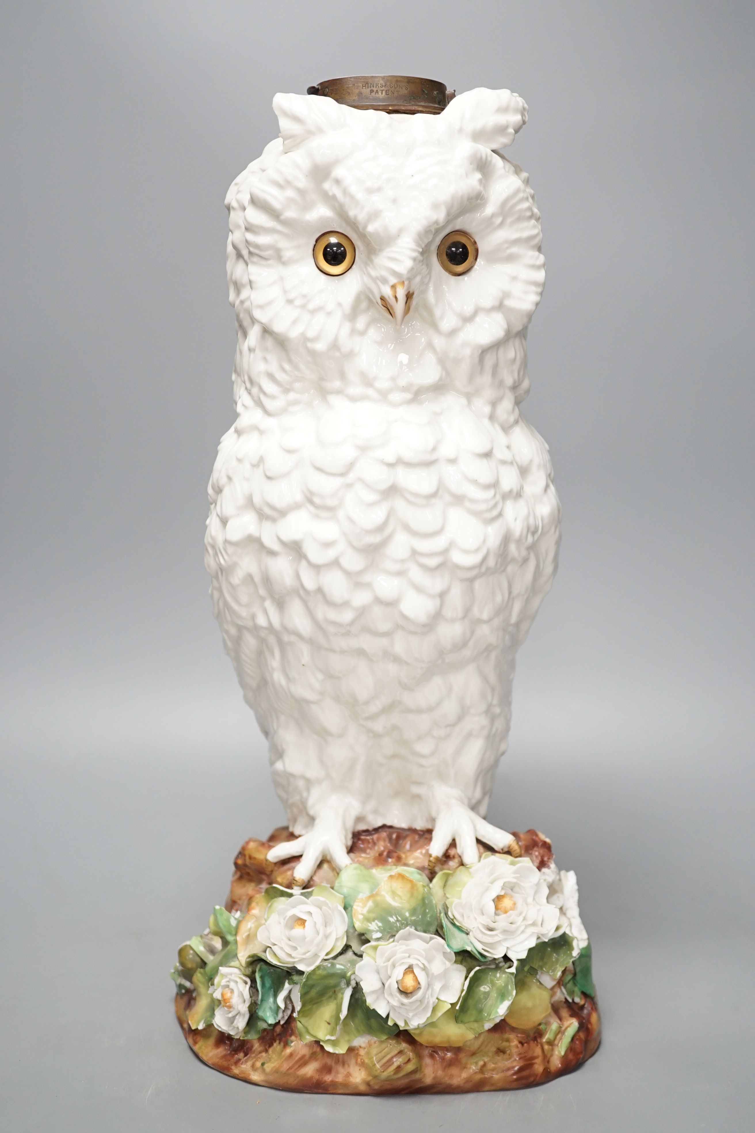 A large late 19th century ‘owl’ porcelain oil lamp base, with Victorian lozenge registration mark to base, probably Sitzendorf, 46 cms high.